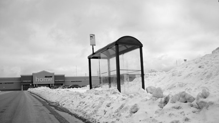 Iced-up bus shelter in front of Empire Bayers Lake