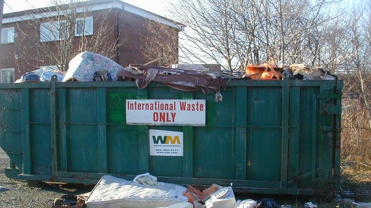 Overflowing trash bin on Best Street in Dartmouth.