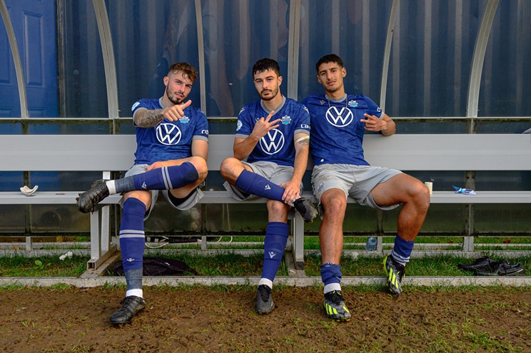 Halifax Wanderers Cale Loughrey, Riley Ferrazzo and Tomas Giraldo share a moment after defeating Forge FC on Sept. 30, 2023.