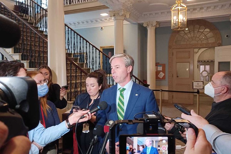 Premier Tim Houston scrums with reporters in Province House following the budget address on Thursday, March 23.