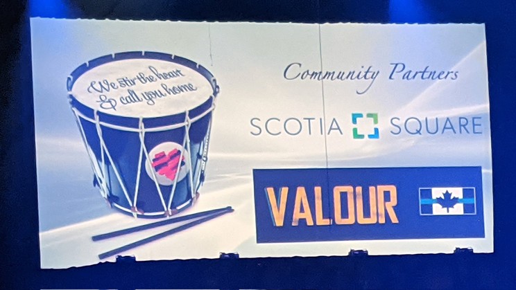 VALOUR Maritime Society's logo displayed at the Royal Nova Scotia International Tattoo on Tuesday. What colour would you say that stripe is?