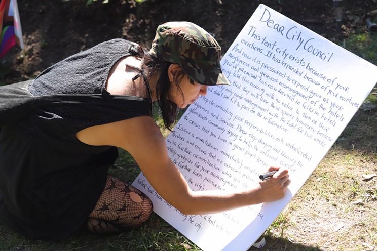 Rachelle Sauvé writes a letter to the city on behalf of people with no safe place to sleep Wednesday night.