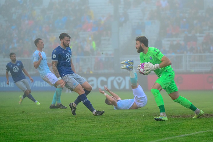 HFX Wanderers FC goalkeeper Yann Fillion picks up the ball during his club's 2-1 victory over Pacific FC on July 11, 2023.